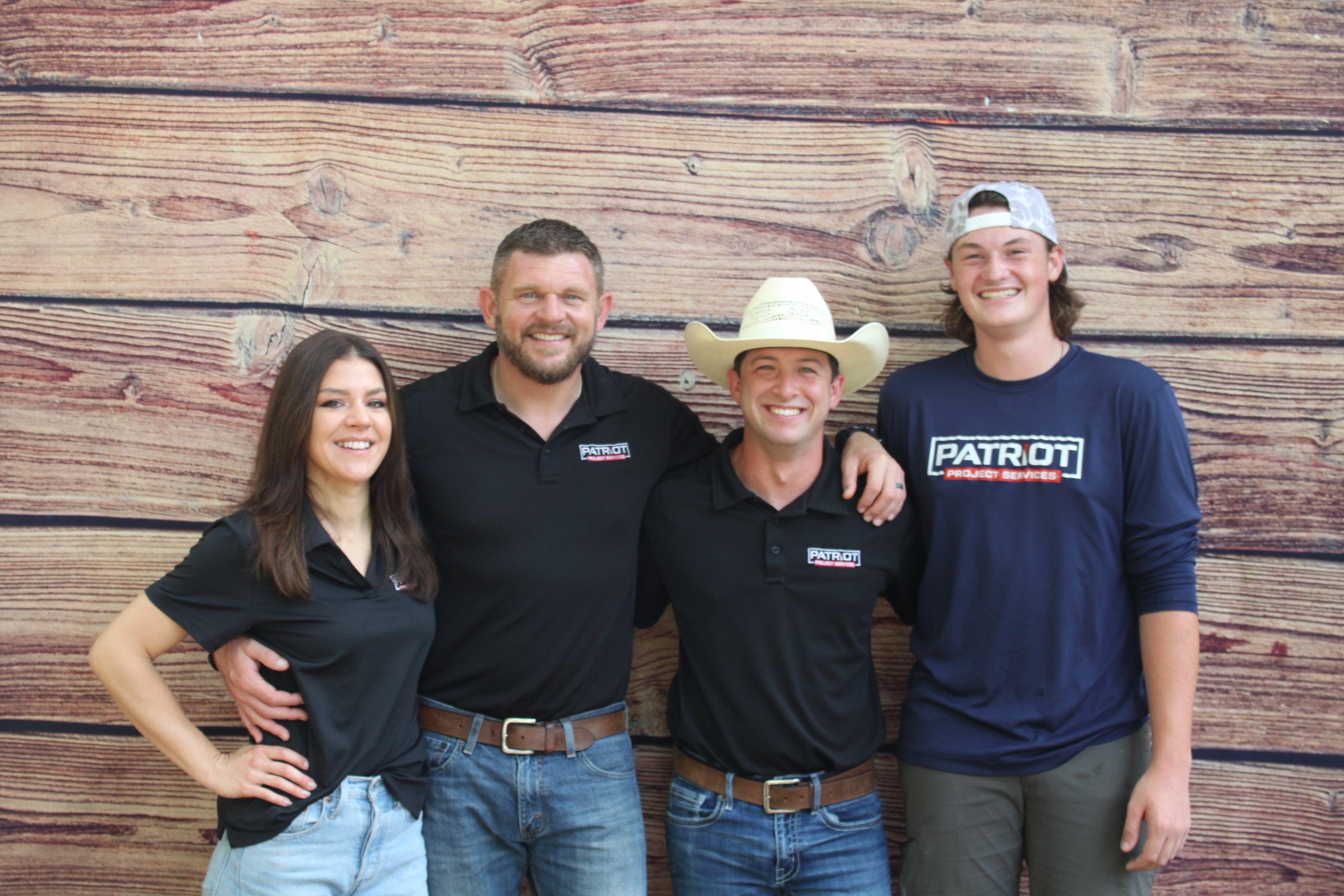 Four Team Members Smiling